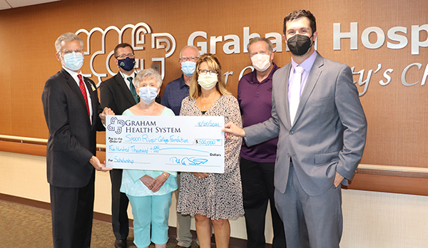 Graham Health System presents check to SRC Foundation