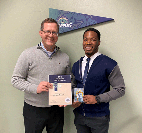 Jarius Tarver receiving November Student Shour Out award from SRC President, Curt Oldfield