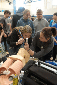students learning intubating skills at the 10th Grade Career Expo. 