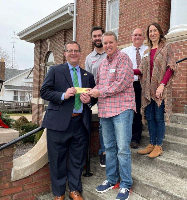 Dr. Curt Oldfield (President, SRC), Colin Davis (Exec. Director, SRC Foundation), Rev. Kelly Ingersoll (FCC), Brad O’Brien (Dean of Career & Workforce Education, SRC), and Anne Ingersoll (FCC), on church steps.