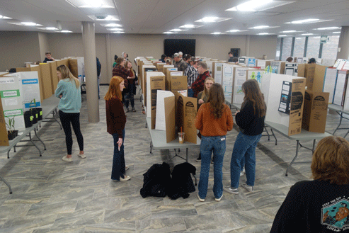 Students viewing displays at the Research Poster event