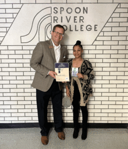 SRC President Curt Oldfield presenting Connehsa Posey with the Student Shout-Out Award for September and a $100 Visa gift card.