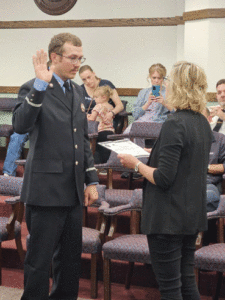 Image of Coulton Wascher being sworn in as a new firefighter for Macomb, IL Fire Department