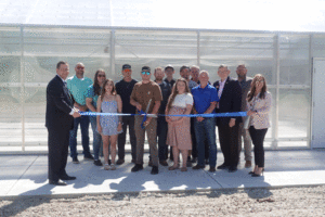 Students, employees, and guests at the ribbon cutting for a new greenhouse made possible with a Compeer Financial grant.