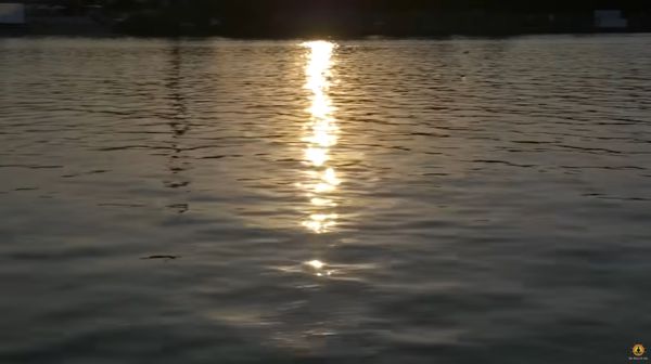 image of sunlight reflected on the surface of a lake
