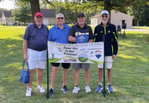 Image of Scott King, David Bland, Gregg Norman, and Ron Buhrow, winning team of this year’s Golf Outing.