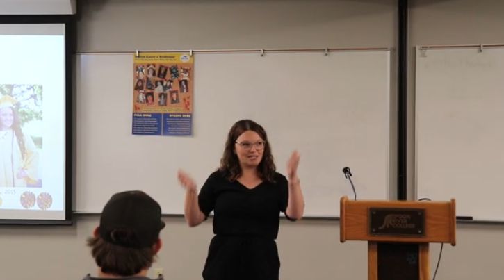 Allyson Smith giving college theme presentation, "My Journey Back Home"