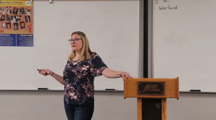 English professor, Becca Werland giving college theme presentation, "Rewrites & Redirections: Courage, Change, and Starting Over"