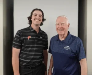Image of new Student Trustee Logan Booth with Board Chair Jerry Cremer at April Board of Trustees meeting
