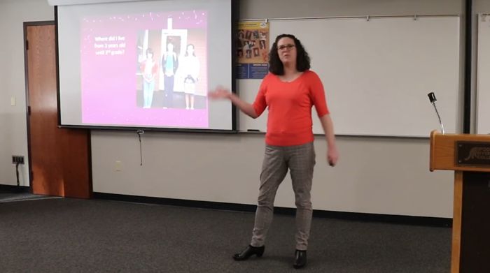 Math professor, Sarah Dalpiaz, presenting College Theme presentation
