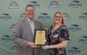 Faculty Award recipient Rebecca Werland being presented her award by President Oldfield
