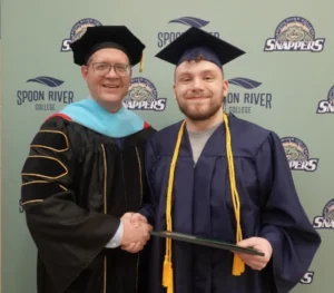Pay It Forward Scholarship recipient Shyler White with President Oldfield at SRC Commencement
