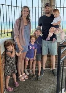 Keith Mellert pictured with his wife and their four young children