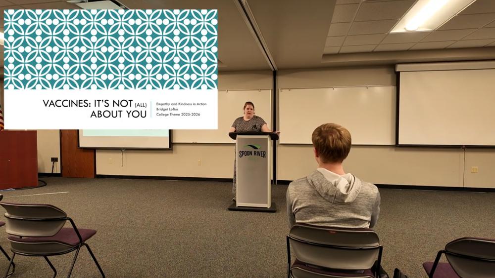 Chemistry instructor, Bridget Loftus, giving college theme presentation on vaccines.