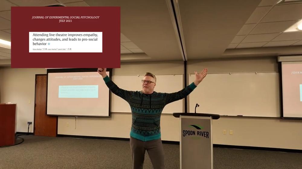 Drama and English instructor, Doug Okey giving college theme presentation on empathy